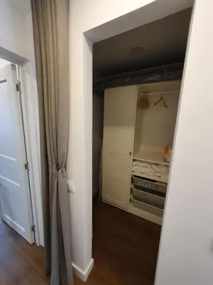 a room with a closet with a door open at Talsa 1-bedroom apartment in city center Šiauliai in Šiauliai