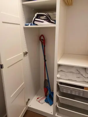 a white closet with a mop in it at Talsa 1-bedroom apartment in city center Šiauliai in Šiauliai