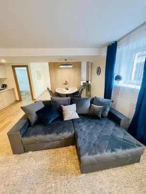 a living room with a couch and a table at Alanta Apartments Easy Kaunas in Kaunas