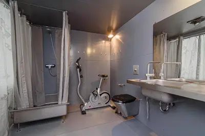 a bathroom with a shower and a sink at Hidden Submarine in Vilnius
