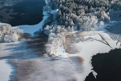 an aerial view of an island in the water at Beautiful Tiny house on the lake side. in Trakai