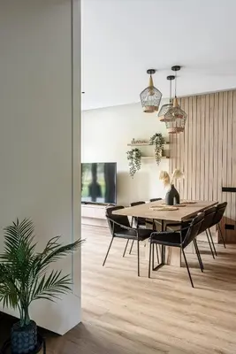 a dining room with a table and chairs at Pirties Spa namas in Molėtai