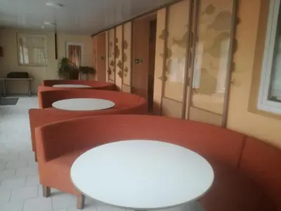 a row of red sinks in a bathroom at Svečių namai ALDAIVITA in Ignalina