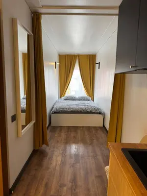 a bedroom with a bed and a window at Apartments in Kaunas in Kaunas