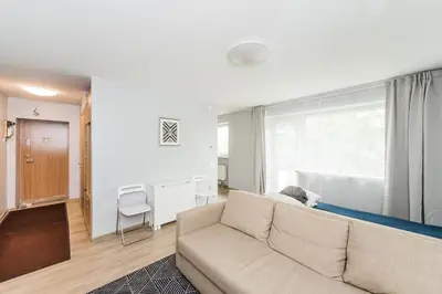 a living room with a couch and a bed at Apartments in Kaunas in Kaunas