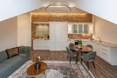 a living room with a couch and a table at Artsy Exclusive Old Town Residence Gallery Walk in Vilnius