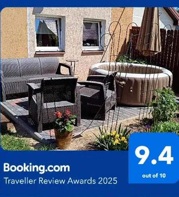 a picture of a patio with a bench and a tub at Namelis uždarame kieme in Šiauliai