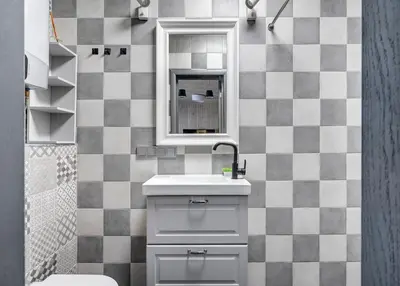 a bathroom with a sink and a mirror at Bajorų sodyba in Padvarionys