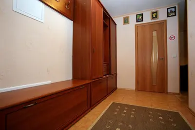 a room with a large wooden cabinet and a door at Neravu namai in Druskininkai