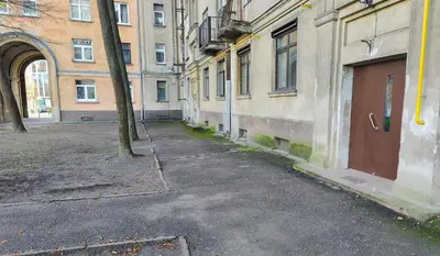 an empty alley in a city with buildings at Žalgiris arena apartment with AC in Kaunas