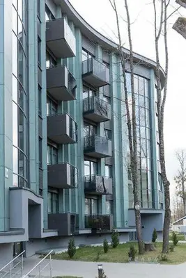 a large building with balconies on the side of it at Vita Apartment in Druskininkai