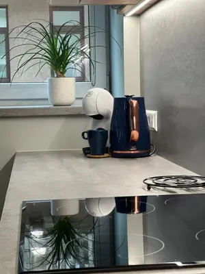 a kitchen counter top with a coffee maker on it at Daukanto 5 in Kaunas