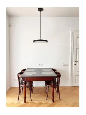 a dining room with a table and some chairs at NEW! WARM and COSY apartment with private ENTRANCE and PARKING in a city center in Vilnius