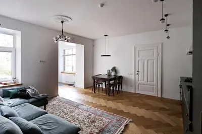 a living room with a couch and a table at NEW! WARM and COSY apartment with private ENTRANCE and PARKING in a city center in Vilnius