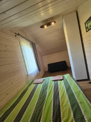 a room with a bed in a small room at Bona Natura Pirtelė in GratiÅ¡kÄ—s