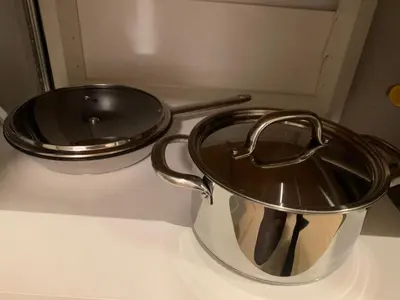 a pot and a pan sitting on a counter at New Ozas flat in Vilnius