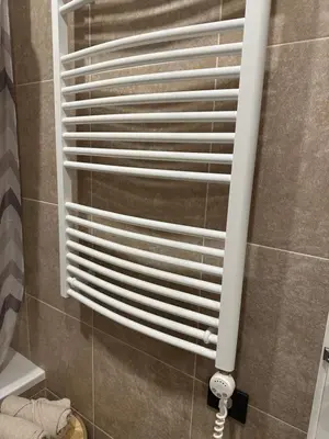 a shower with white blinds in a bathroom at New Ozas flat in Vilnius