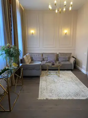 a living room with a couch and a table at Old town apartment in Kaunas