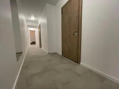 a hallway with a door and a tile floor at Modern guest house in city center I Room 1 in Vilnius