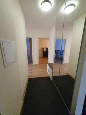 a room with a glass shower in a building at Dainai 1-Bedroom apartament. in Šiauliai