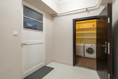 a laundry room with a washer and dryer at Archcathedral apartment by Polo Apartments in Kaunas