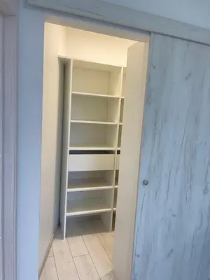 a walk in closet with a door open at Central apartment in Vilnius