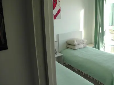 a small bedroom with a bed and a window at SPA TOWN house I in Druskininkai