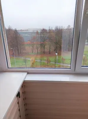 a window with a view of a field at Apartamentai šalia parko in Šiauliai