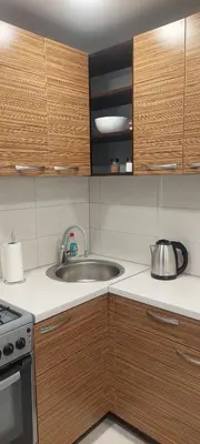 a kitchen with a sink and a stove at Pakeliui in Kaunas