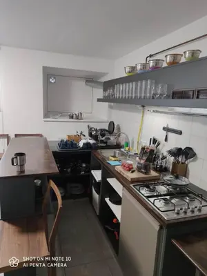 a kitchen with a stove and a counter top at Centro Hostel in Vilnius