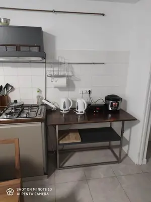 a kitchen with a stove and a counter top at Centro Hostel in Vilnius