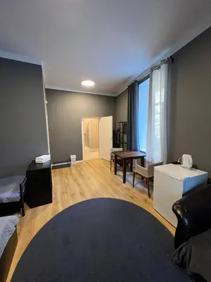 a living room with a couch and a table at Centro Hostel in Vilnius