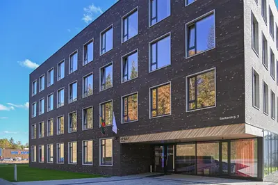a black building with a lot of windows at SHED Vilnius Coliving in Vilnius