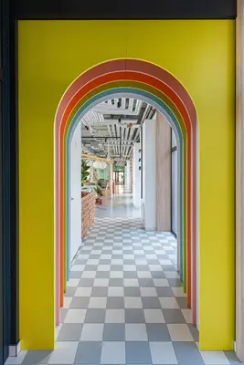 a hallway with a rainbow painted on the wall at SHED Vilnius Coliving in Vilnius