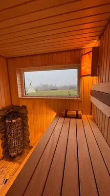 an empty room with a window in a cabin at Lake House in Anykščiai