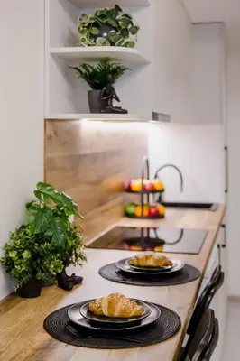 a kitchen with two plates of food on a counter at Stylish Apartment in Zverynas in Vilnius