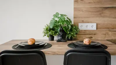 a table with two plates of food on it at Stylish Apartment in Zverynas in Vilnius