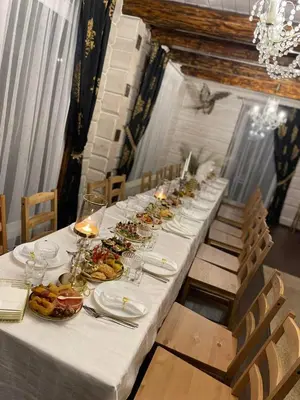 a long table with plates of food on it at Homestead - Ukmergė area in Pabariškiai