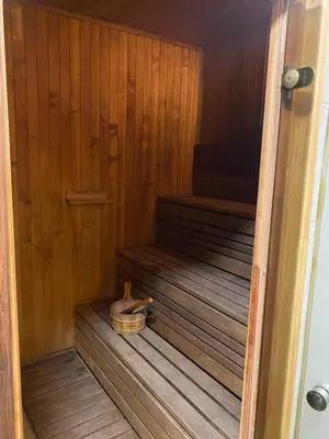 a wooden sauna with a wooden shoe in it at Homestead - Ukmergė area in Pabariškiai