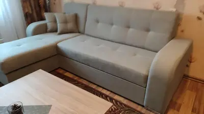 a living room with a couch and a table at Rami nakvynė Panevėžyje in Panevėžys