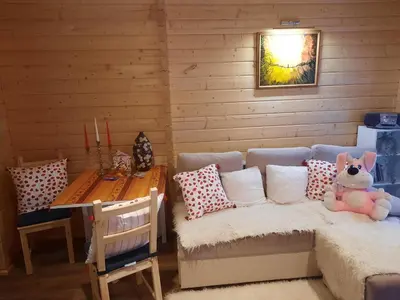a room with a bed and a table with a table at The Archers House in Viktariškės