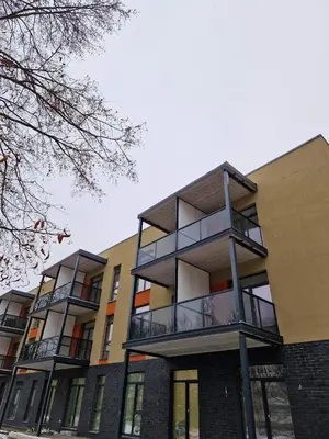 a building with balconies on the side of it at Parko nauji apartamentai in Panevėžys