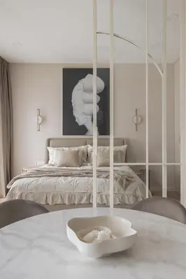 a room with a bed and a table with a bowl on it at IVIS House - Elegant Apartment with Church View in Vilnius Old Town in Vilnius