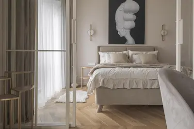 a bedroom with a bed with a glass door at IVIS House - Elegant Apartment with Church View in Vilnius Old Town in Vilnius