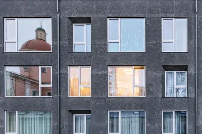a facade of a building with many windows at IVIS House - Elegant Apartment with Church View in Vilnius Old Town in Vilnius