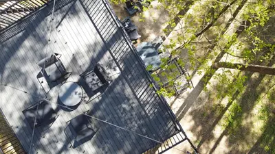 an overhead view of a building with a car on it at Premium Forest Bungalow with Ofuro Tub in Luokesos Sen
