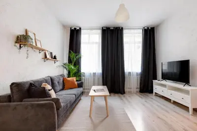 a living room with a couch and a tv at #stayhere - Cozy 1BDR Apartment Vilnius Old Town in Vilnius