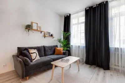a living room with a couch and a table at #stayhere - Cozy 1BDR Apartment Vilnius Old Town in Vilnius