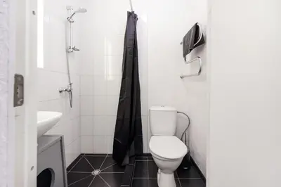 a small bathroom with a toilet and a sink at #stayhere - Cozy 1BDR Apartment Vilnius Old Town in Vilnius