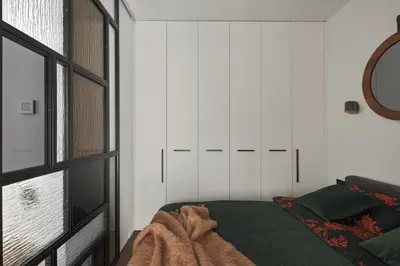 a bedroom with a bed and a window at IVIS House - Stylish and Original Apartment in Vilnius Old Town in Vilnius